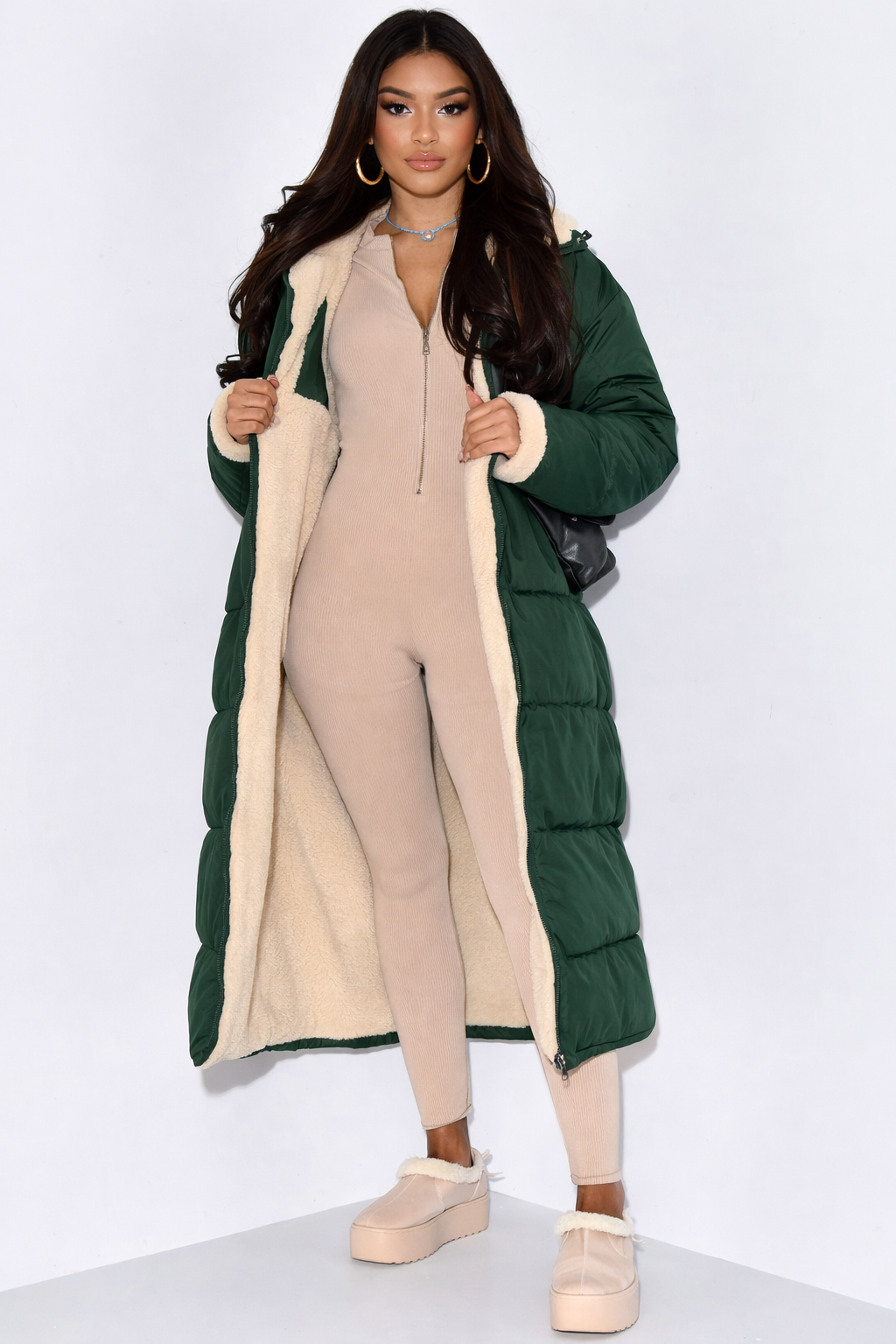 Women's full-length hooded puffer coat, insulated for ultimate warmth. Perfect cold weather winter jacket.