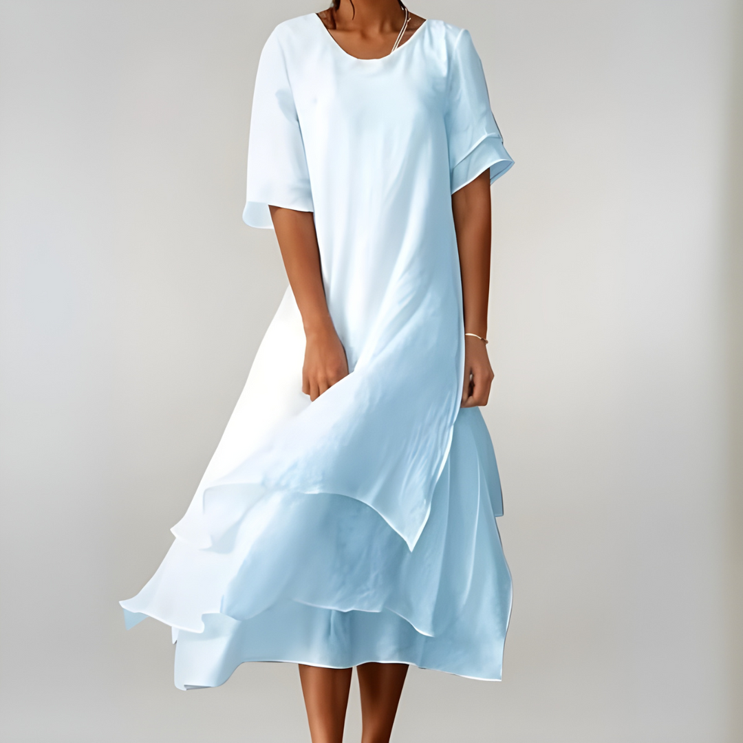 Feminine women's long flowy summer dress, lightweight and comfortable for a casual elegant look. Ideal for warm weather.