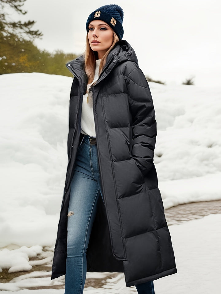Versatile women's long padded winter coat with hood, essential for warm and stylish outerwear.