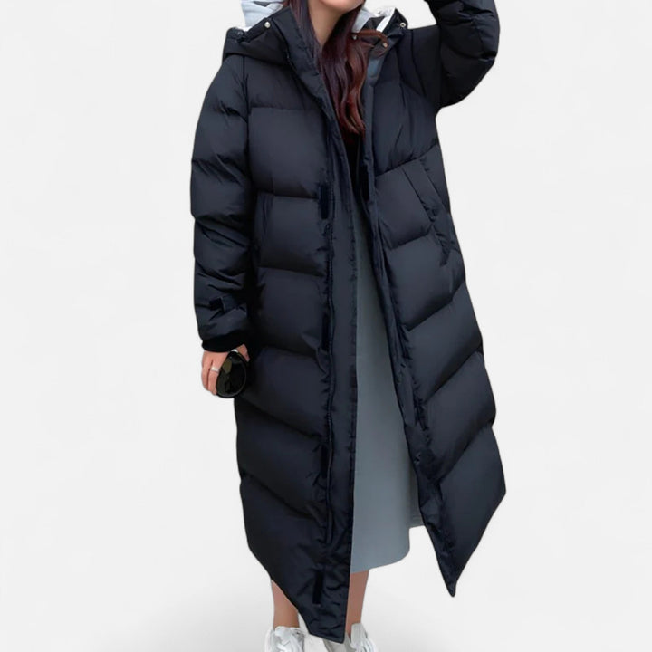 Women's long puffer jacket for ultimate warmth and stylish winter fashion. Insulated black ladies coat for cold weather.