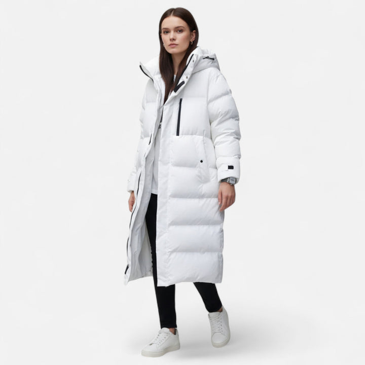 Elegant women's long puffer jacket, a cozy and stylish winter coat for ladies. Perfect warm outerwear for cold weather.
