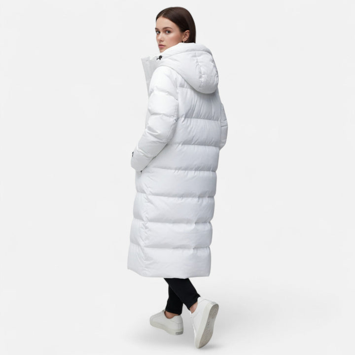 Black or white women's long puffer jacket, a warm and insulated winter coat. Stylish outerwear for cold weather fashion.