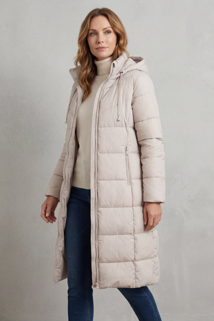 Red women's long puffer coat, quilted design. Stylish & warm winter outerwear with a flattering fit.