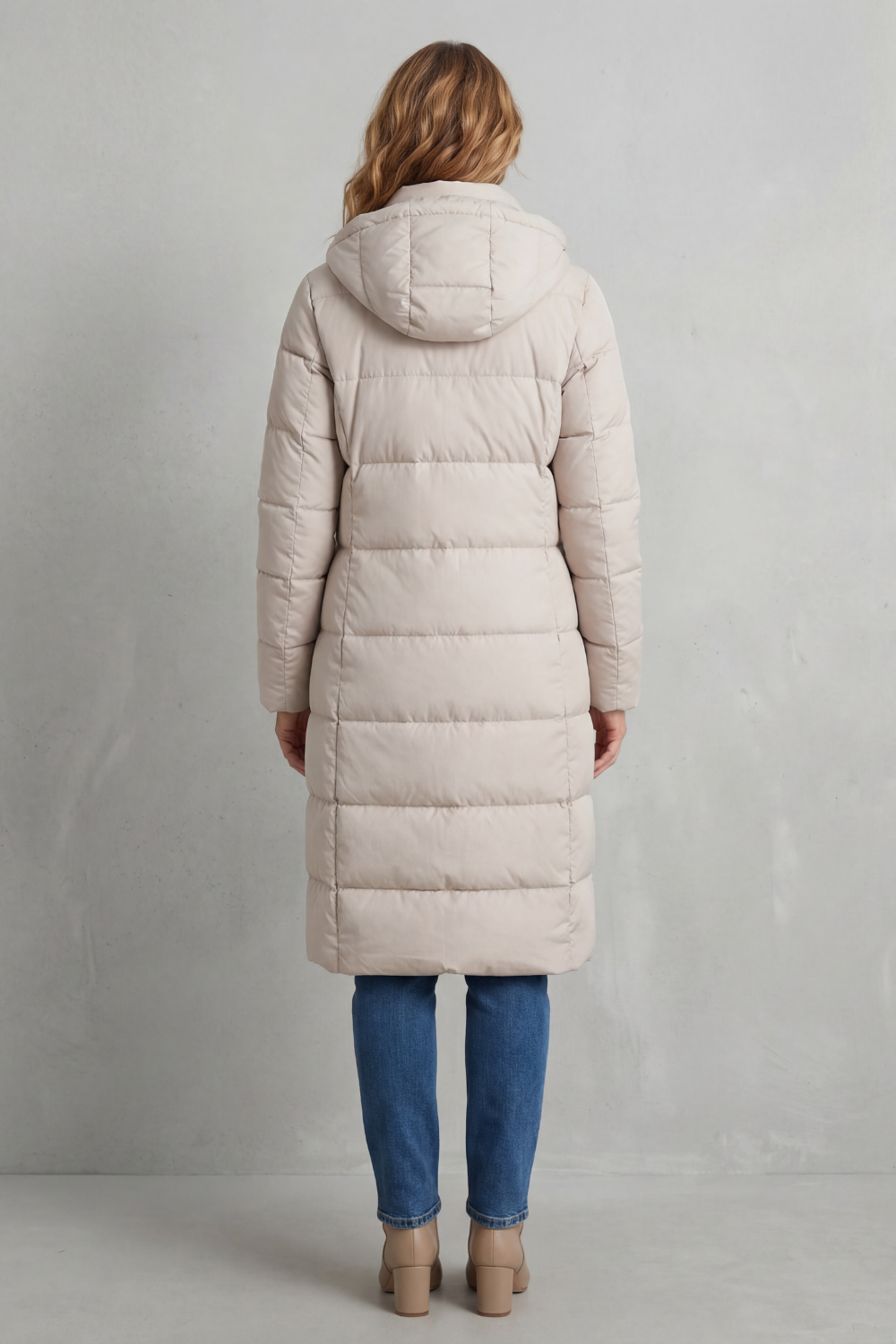 Black women's long quilted puffer coat. Essential warm outerwear for cold weather with a flattering fit.