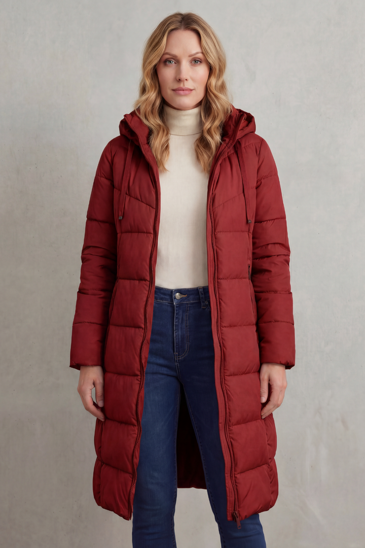 Stylish women's long quilted puffer coat, fashionable winter outerwear. Warm with a flattering fit.