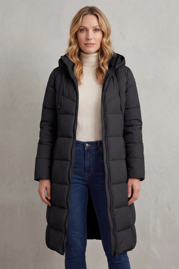 Long women's puffer coat, quilted for warmth & comfort. Fashionable outerwear protects against cold weather.