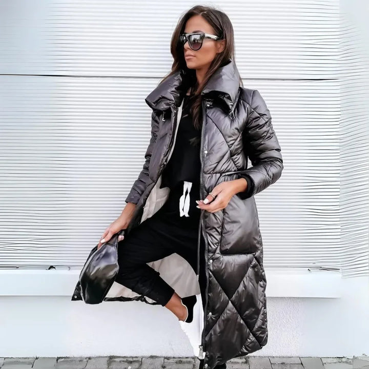 Women's long quilted puffer coat with a stand-up collar, perfect for elegant winter warmth.