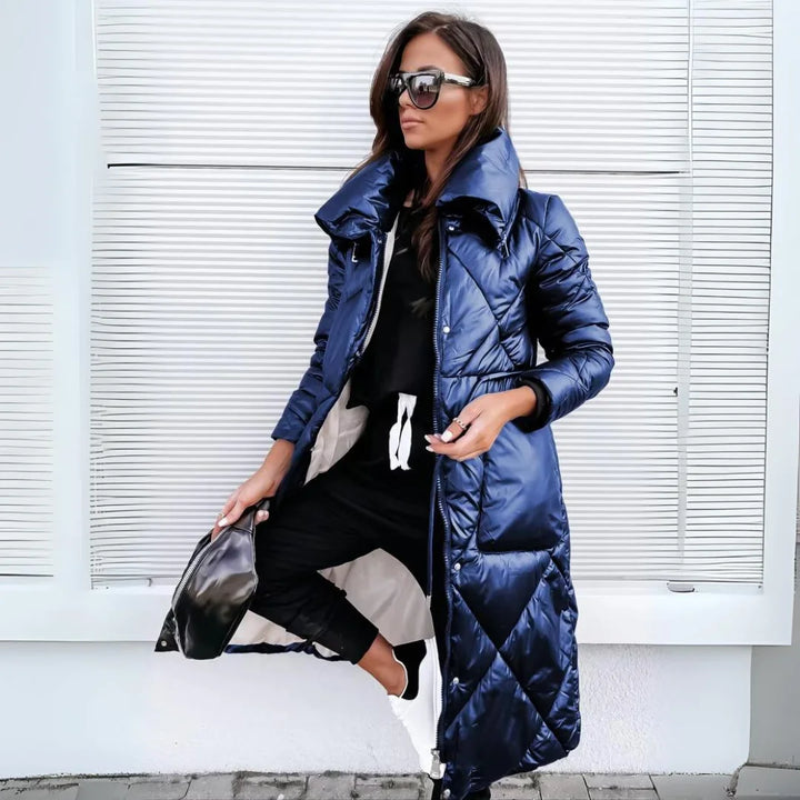 Stylish women's long quilted puffer trench coat for cold weather, offering cozy warmth & elegance.