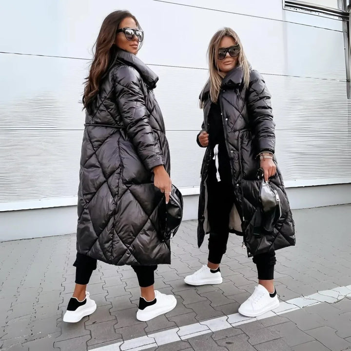 Elegant women's long quilted puffer coat featuring a high stand-up collar, ideal for winter fashion.