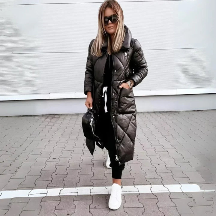 Warm women's long quilted puffer jacket, a cozy and stylish outerwear piece with a chic stand collar.