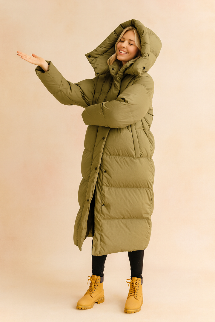 Women's long quilted winter jacket with hood, stylish and warm outerwear.