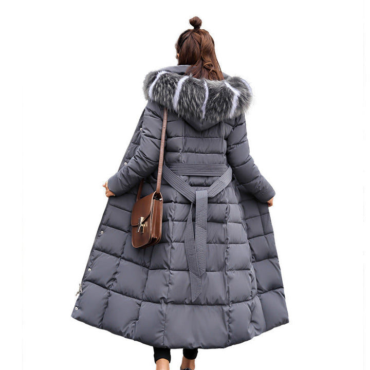 Women's winter essential: long belted parka with a comfortable hood.
