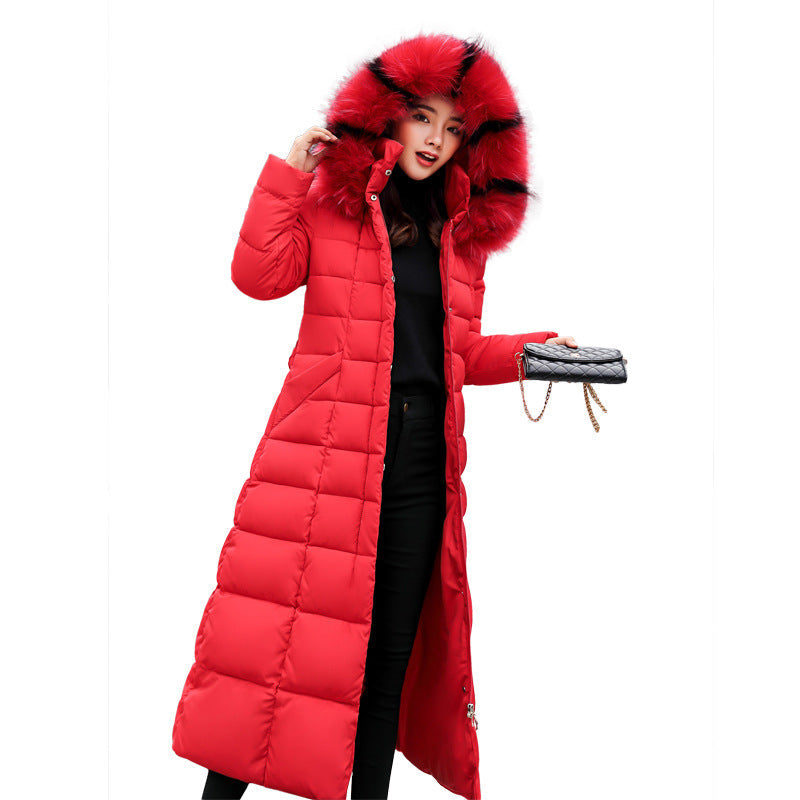 Detailed view of the women's long quilted parka, showing hood and belt.