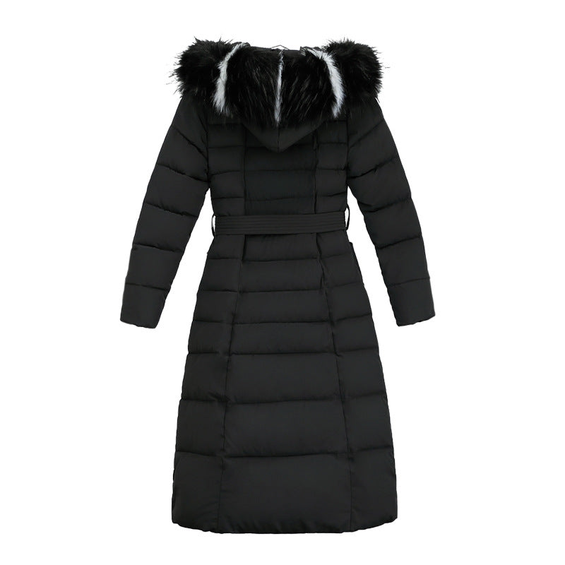 Women's long quilted parka in a winter setting, showcasing style and warmth.