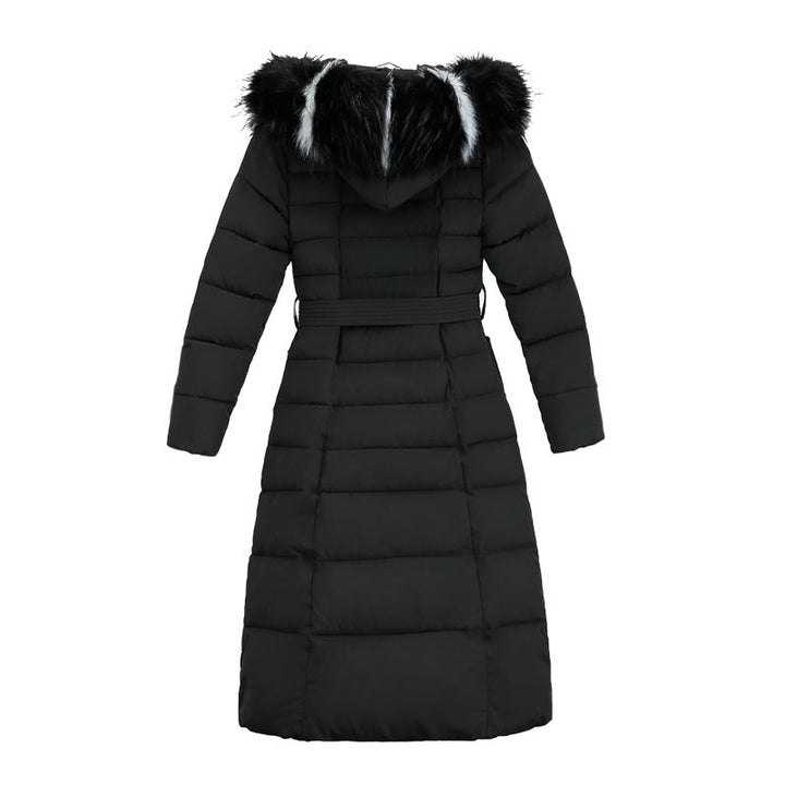 Women's long quilted parka in a winter setting, showcasing style and warmth.