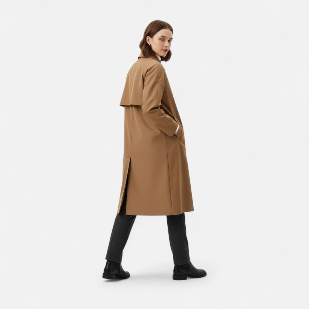 Classic women's long brown trench coat with retro heritage styling, perfect outerwear.