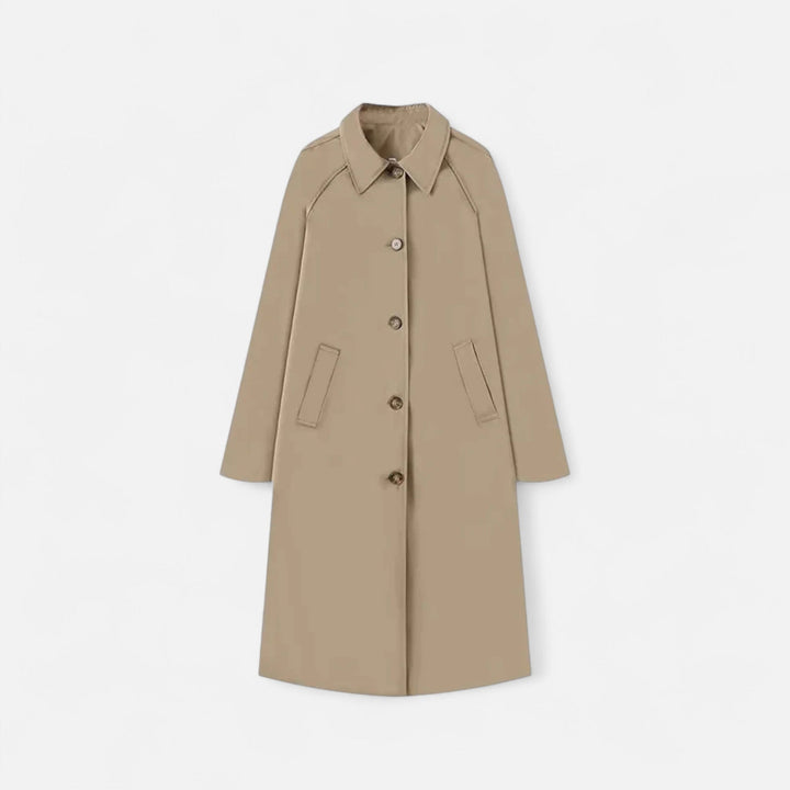Elegant women's long black trench coat, retro heritage style, single-breasted outerwear.