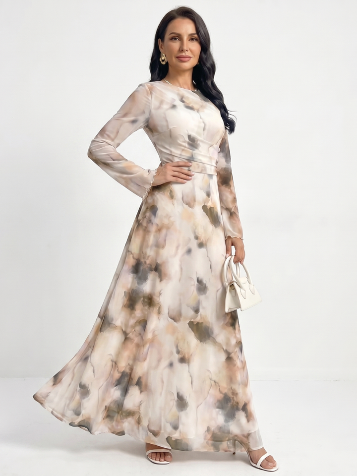 Stylish women's maxi dress featuring long sleeves & a unique abstract print. Perfect for casual or elegant wear.