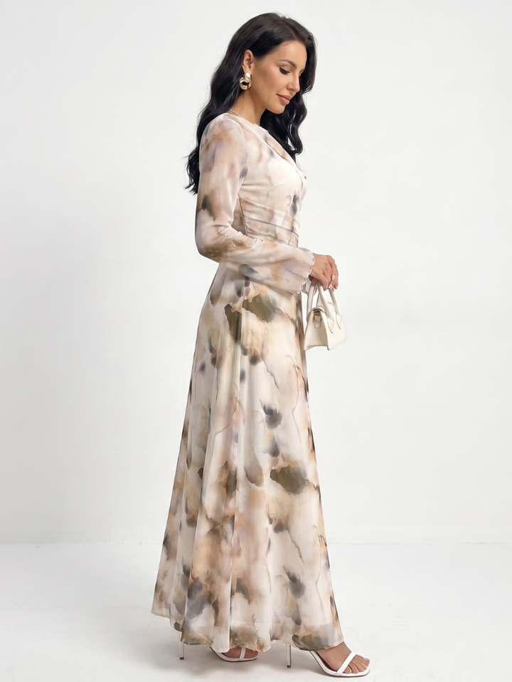 Comfortable round neck long sleeve maxi dress for women, with a chic abstract print & flattering waist definition.
