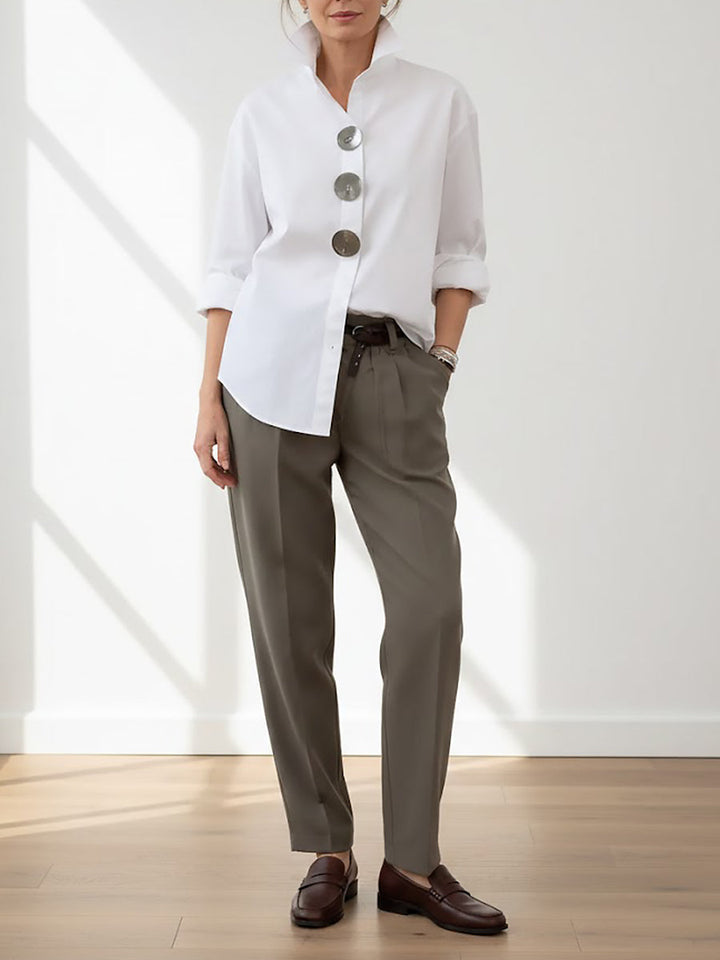 Elegant women's blouse featuring large buttons, long sleeves, and a stylish stand collar for a chic look.