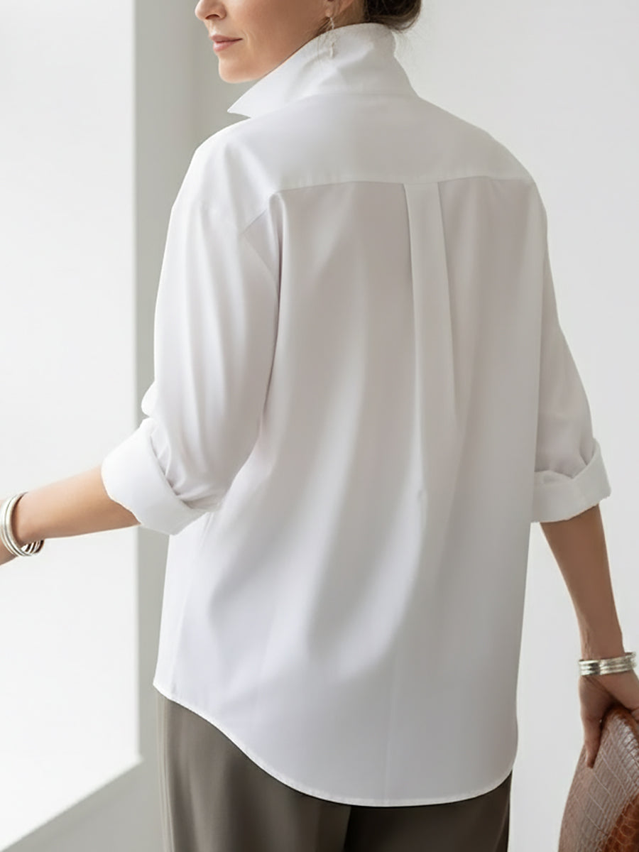 Elegant women's long sleeve button-front blouse. A versatile stand collar top for women's apparel.