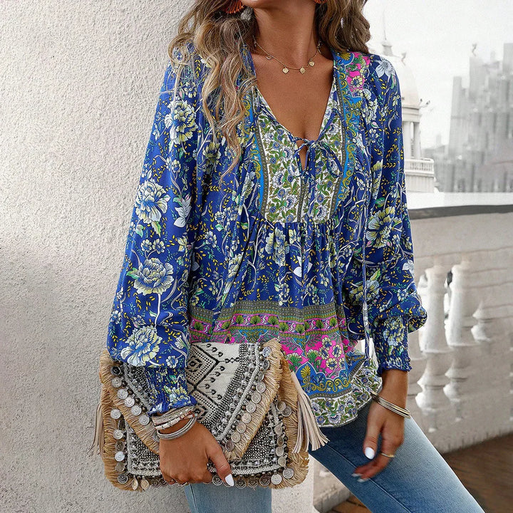 Women's long sleeve bohemian v-neck blouse with a relaxed fit. Perfect for casual, stylish wear.
