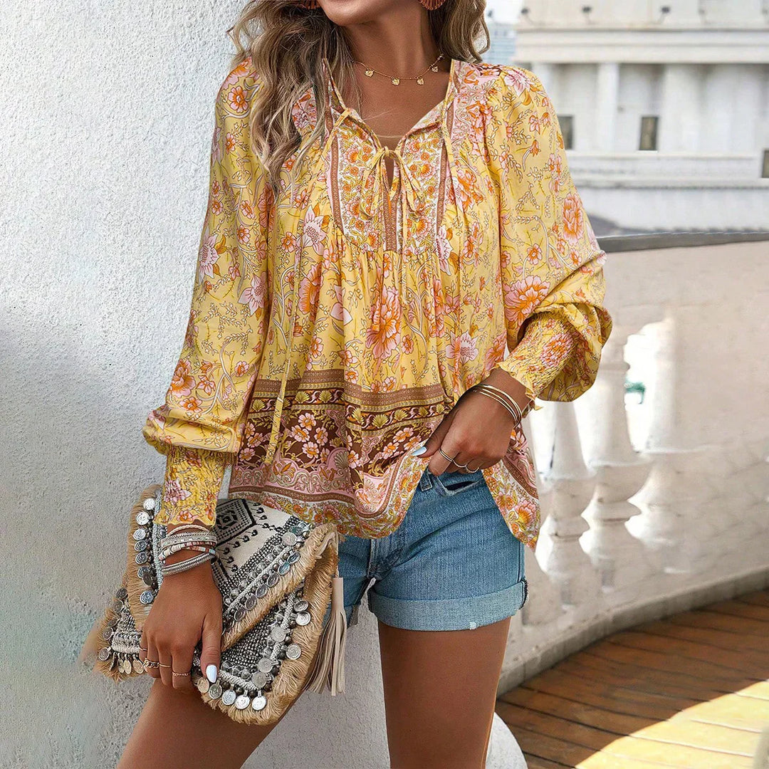 Flowy women's long sleeve bohemian v-neck blouse with unique print. A stylish casual top for any season.