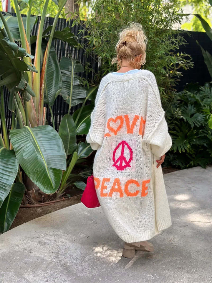 Comfortable women's cardigan featuring a unique "Peace & Love" graphic. Perfect casual layering piece.