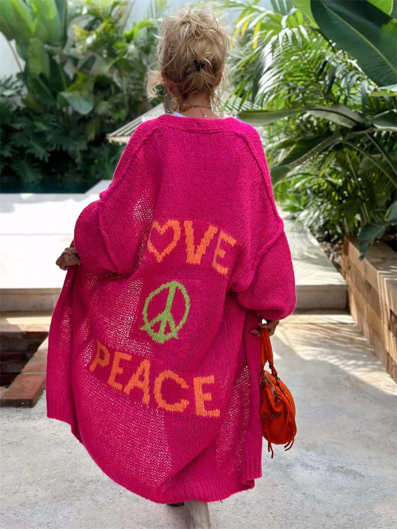 Women's "Peace & Love" graphic cardigan. Cozy long-sleeve sweater, perfect for casual, stylish layering outerwear.