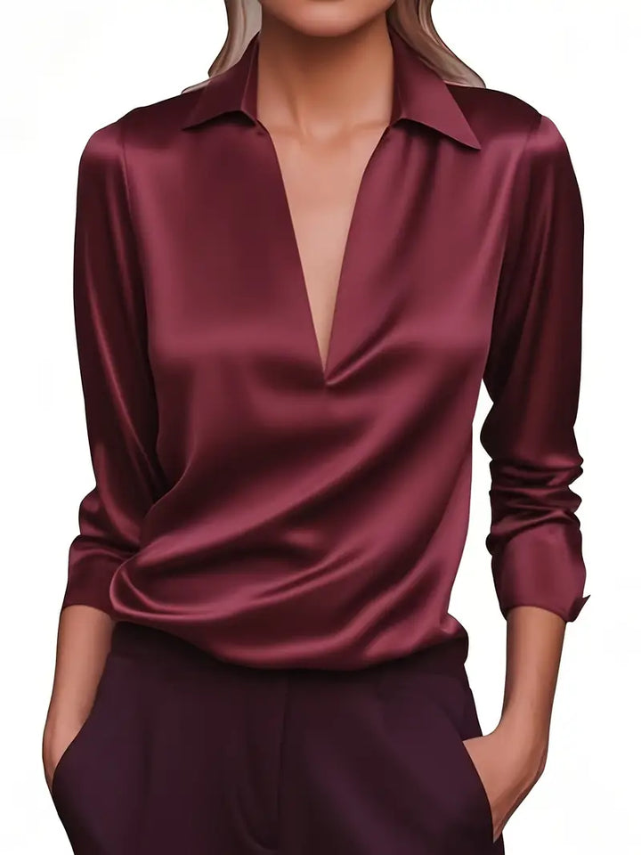 Crisp white women's long sleeve collared V-neck blouse, a classic elegant top for all occasions.