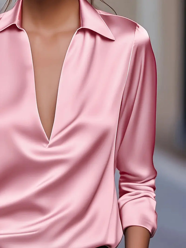 Sophisticated burgundy women's long sleeve V-neck collared blouse, ideal for business casual style.