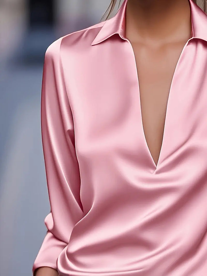 Versatile women's long sleeve collared V-neck blouse, easily dressed up or down for various looks.