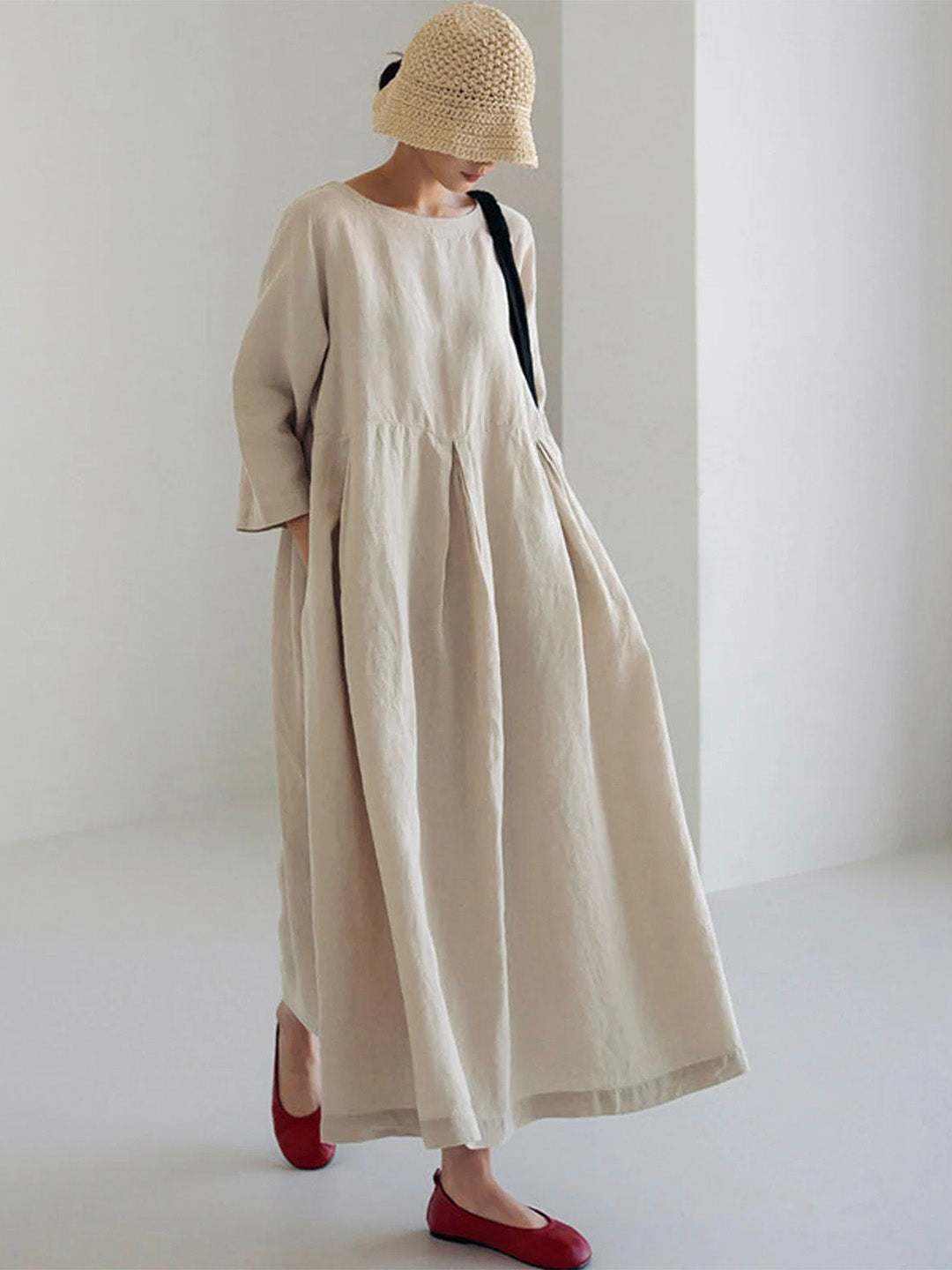 Women's long sleeve round neck tiered maxi dress with a relaxed fit, perfect for comfortable, versatile wear.