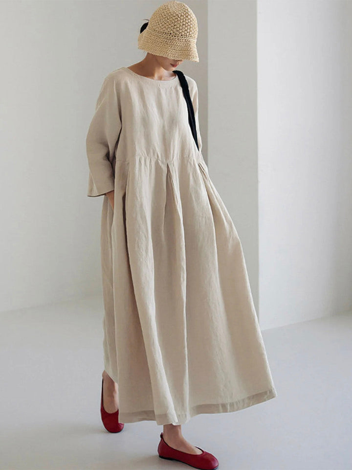 Women's long sleeve round neck tiered maxi dress with a relaxed fit, perfect for comfortable, versatile wear.