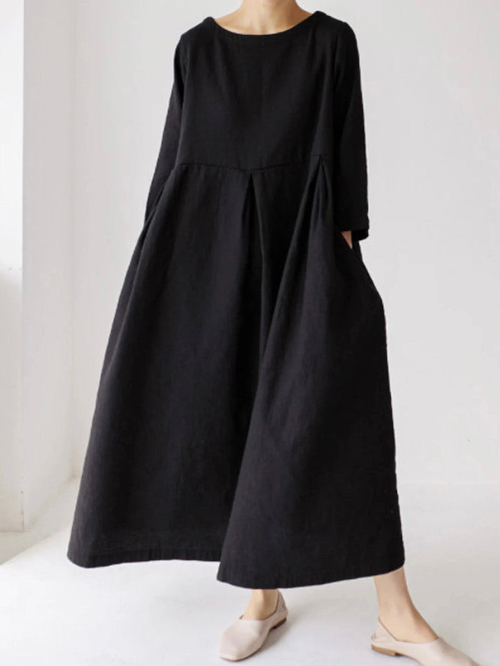Comfortable women's relaxed fit maxi dress, long sleeve, round neck, tiered design. Versatile for all-season style.