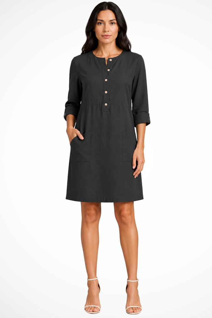Women's long sleeve shirt dress with front pockets. Versatile & chic for everyday wear.