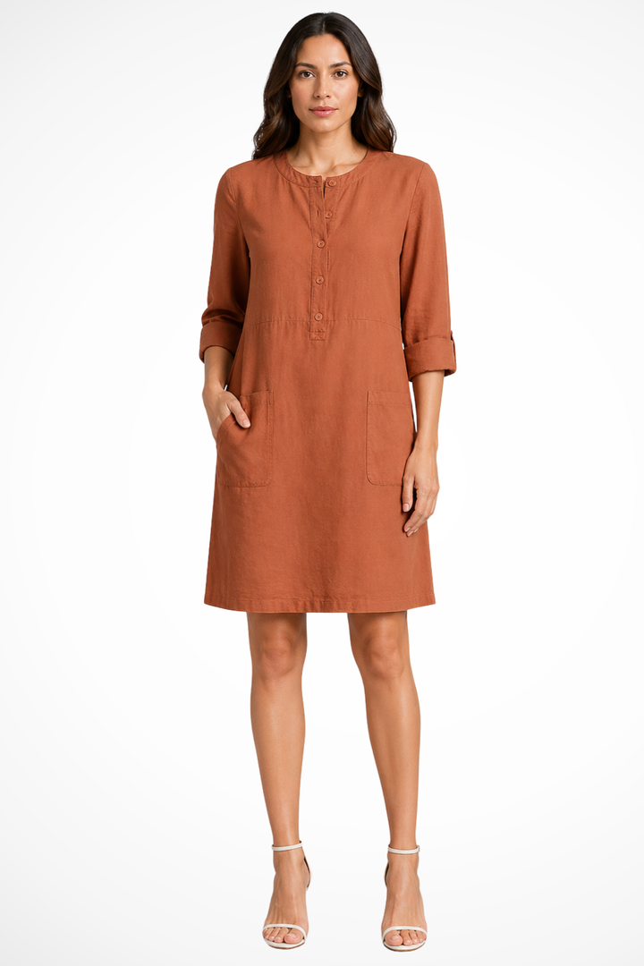 Comfortable women's long sleeve shirt dress with practical front pockets. Versatile minimalist fashion.