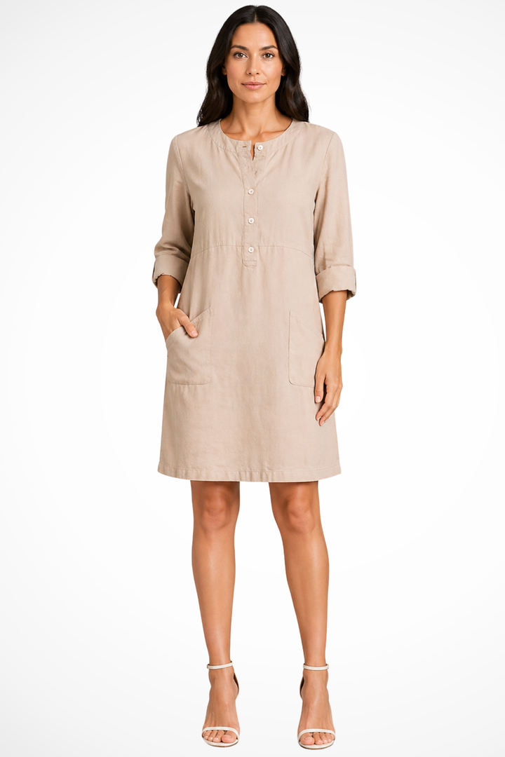 Versatile women's long sleeve shirt dress. Chic design & practical front pockets make it an everyday essential.