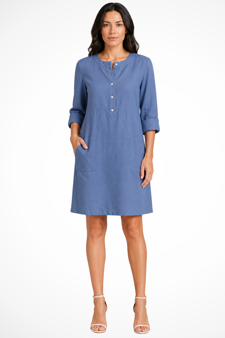 Fashionable women's long sleeve shirt dress. Versatile with practical front pockets, ideal for spring or fall.