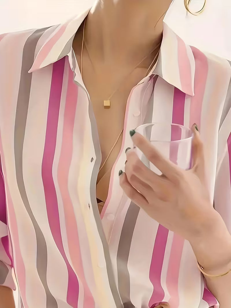 Elegant women's striped button-up top with long sleeves, perfect for casual outings or chic office wear.