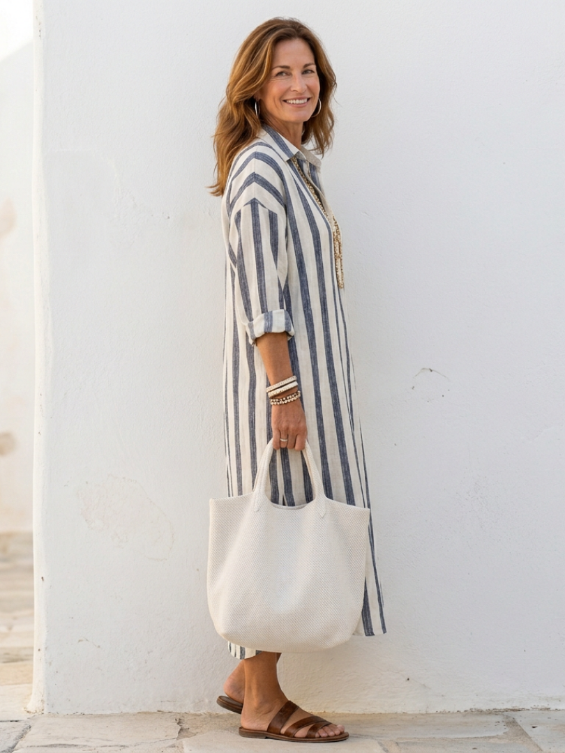 Striped midi shirt dress for women. Long sleeve, casual, with a button front, ideal for versatile everyday wear.