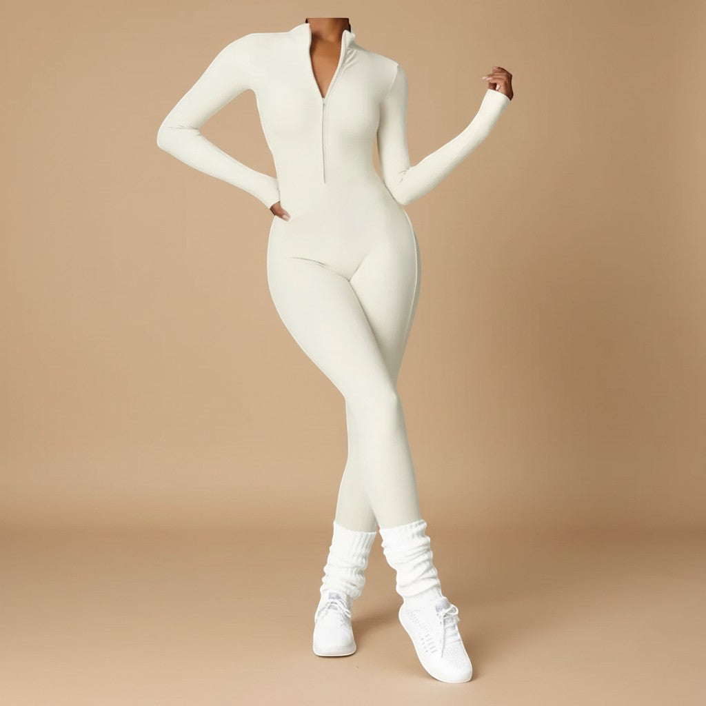 Close-up of a women's sculpting jumpsuit, highlighting the long sleeves and functional zip front detail.