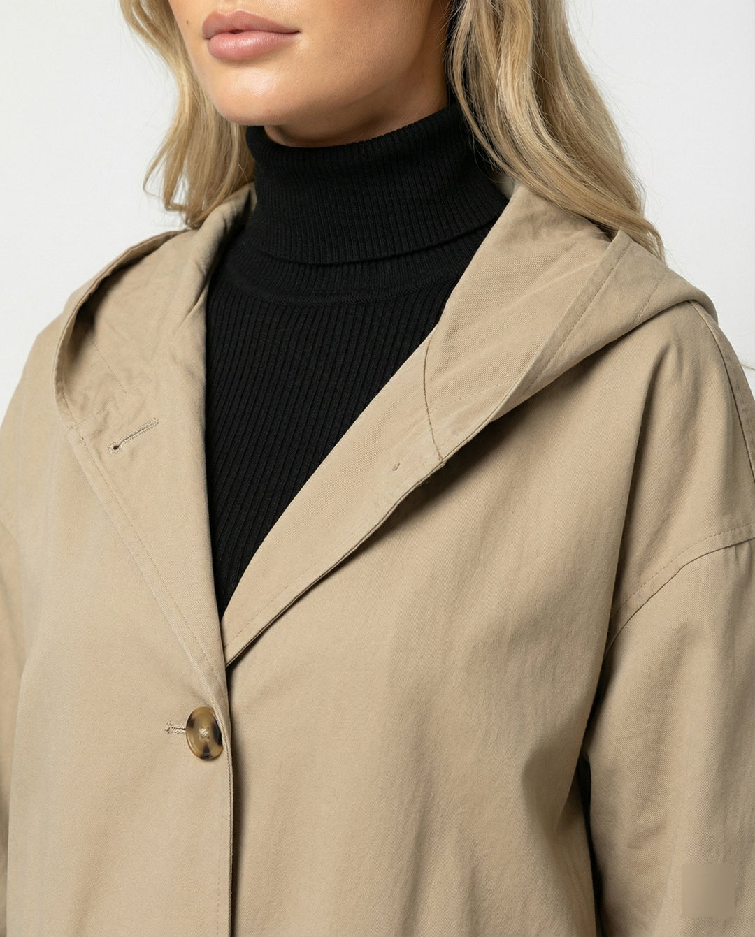 Fashionable women's waterproof trench coat in a long, windproof design, perfect for rainy days.