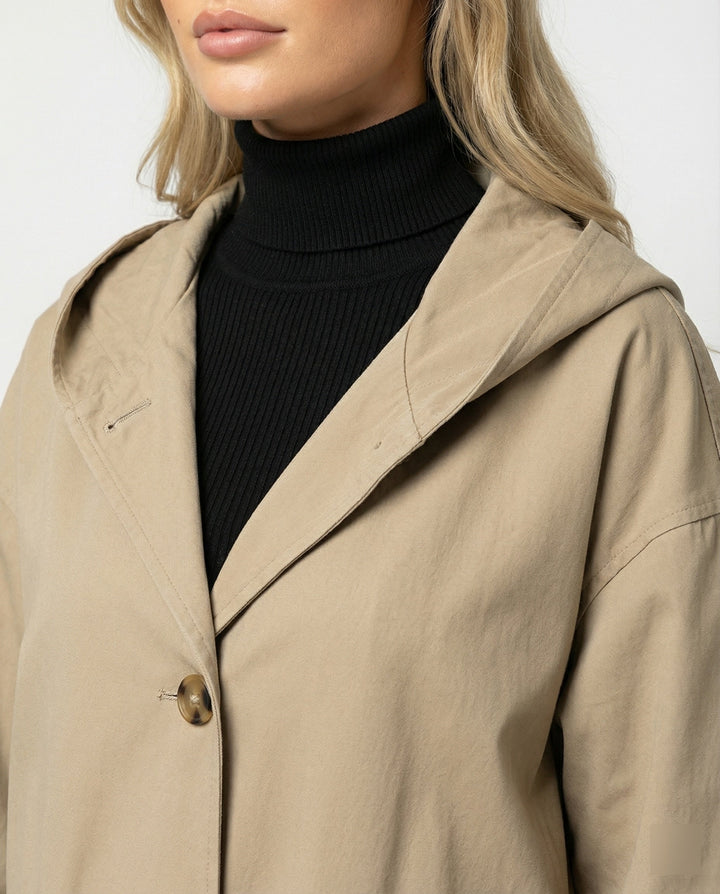 Fashionable women's waterproof trench coat in a long, windproof design, perfect for rainy days.