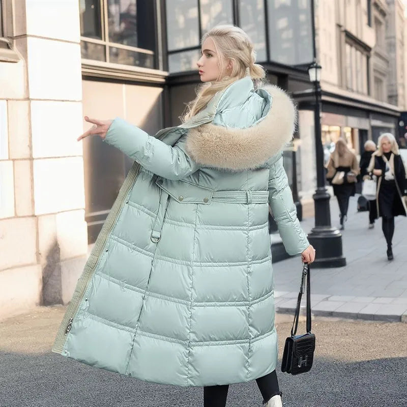 Stay warm in style: women's long winter coat with a fur hood.