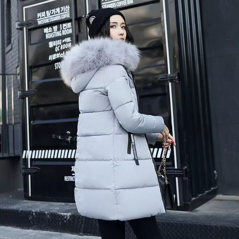 Close-up of women's Helena long parka, showcasing hood and durable winter fabric