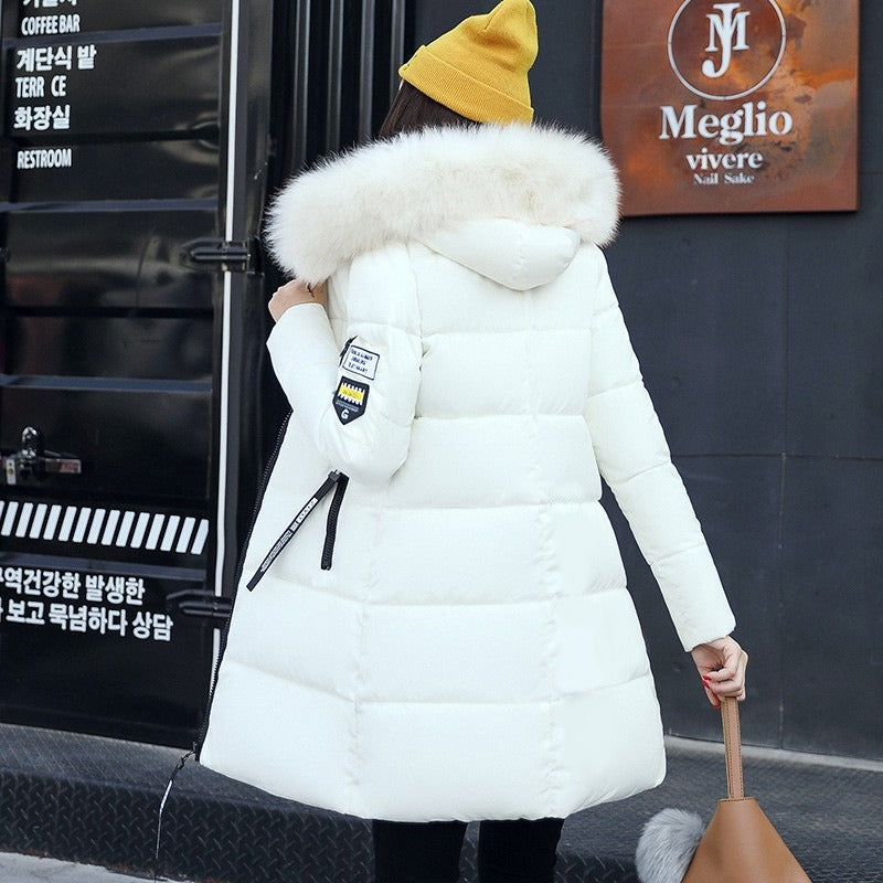 Woman wearing the long winter parka with hood, perfect for staying warm and stylish