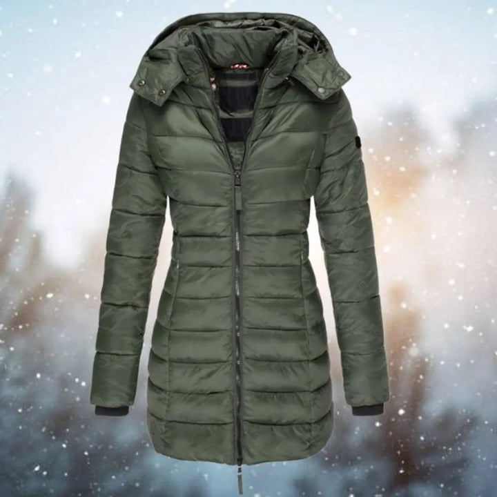 Stylish women's longline hooded puffer jacket, quilted design, versatile winter coat for warmth and fashion.