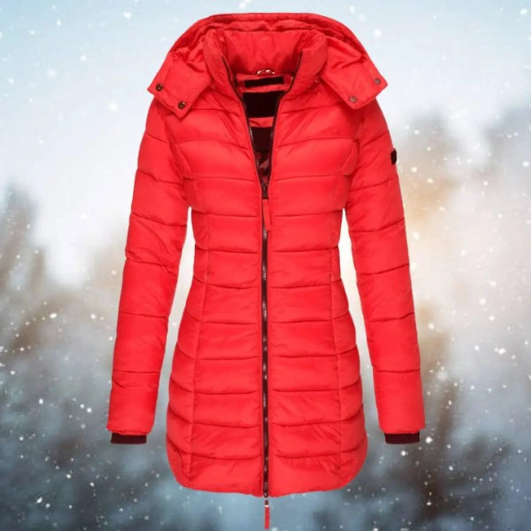 Cozy women's longline puffer jacket, hooded & quilted for ultimate winter warmth and stylish cold weather protection.