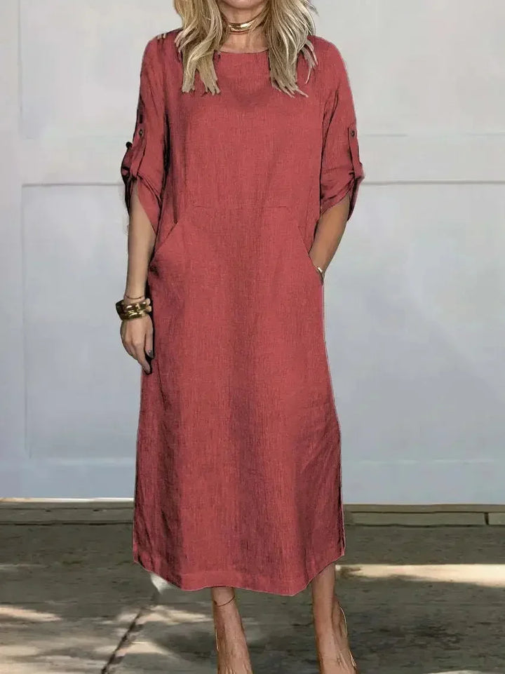Versatile loose A-line midi dress for women with roll-tab sleeves & pockets, ideal for summer casual outfits.